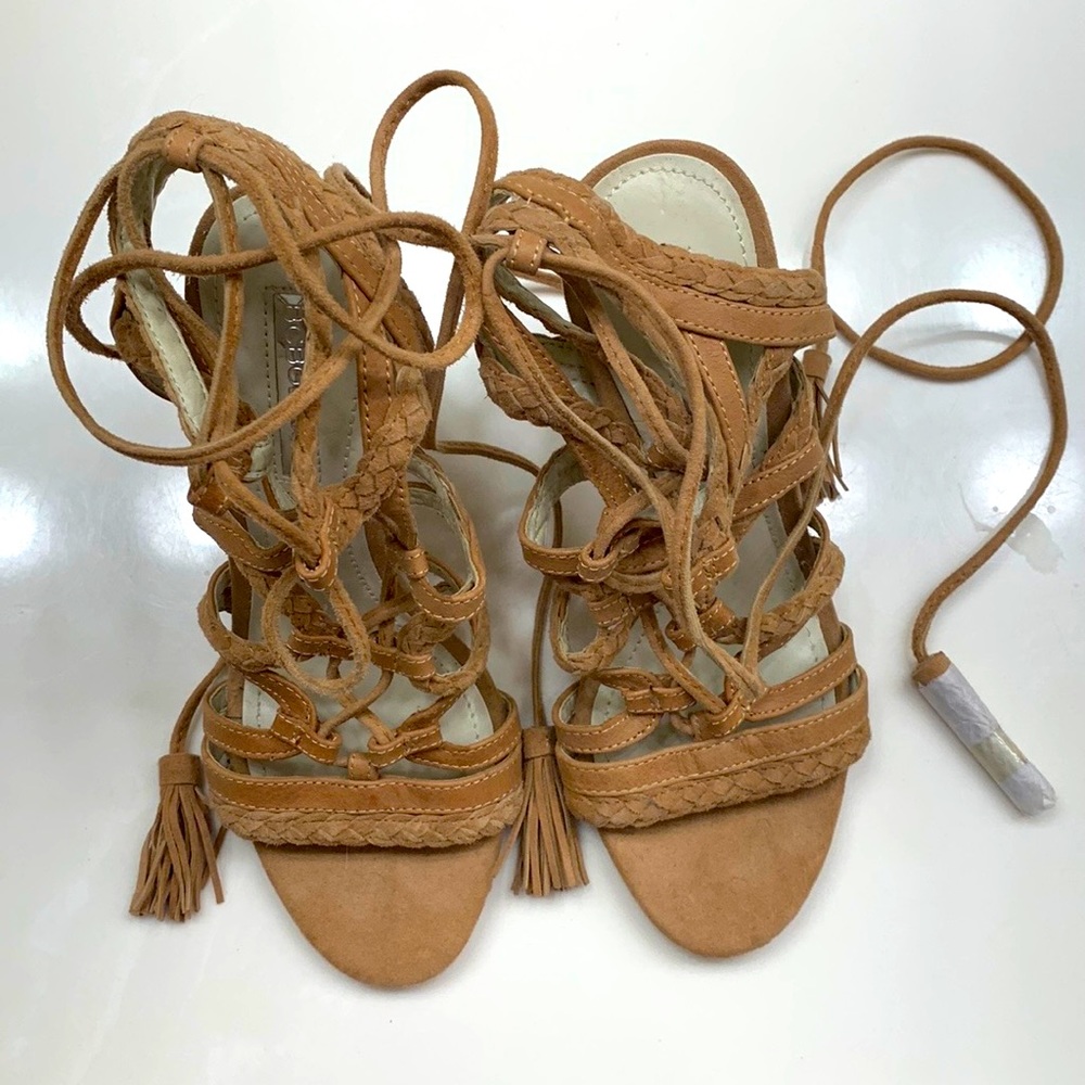 BCBG Strappy shoes. Size 6.  Never worn. basically Brand new